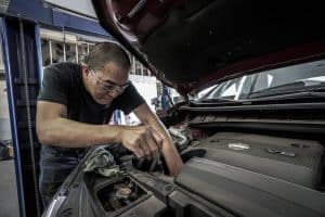 Mechanic repairing a car engine